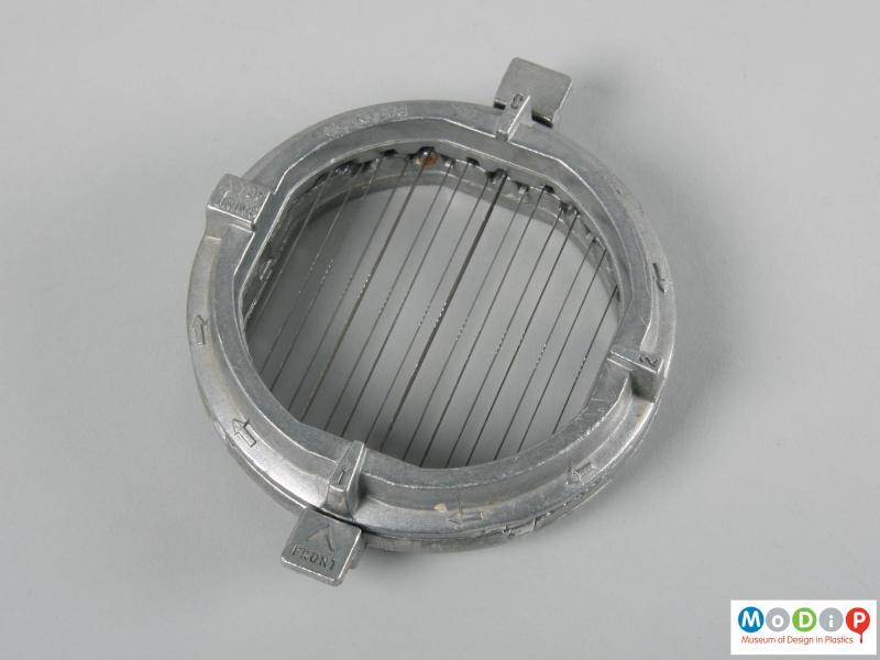 Top view of a food chopper showing the metal blades.