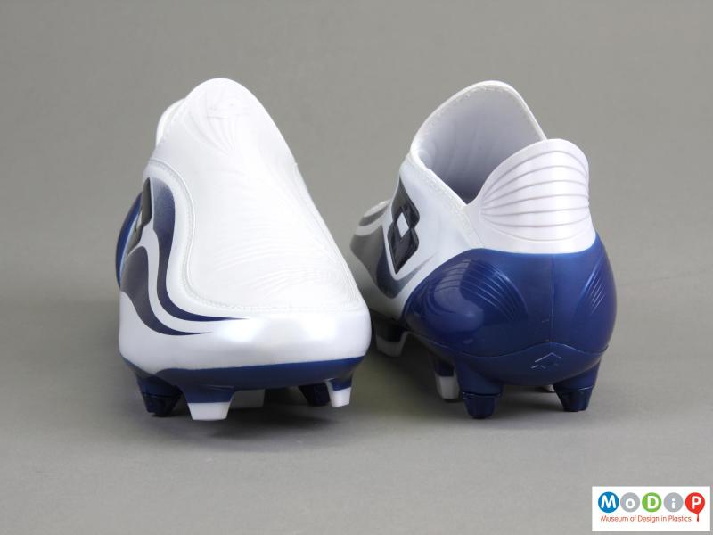 REar view of a pair of football boots showing the shape of the heel.