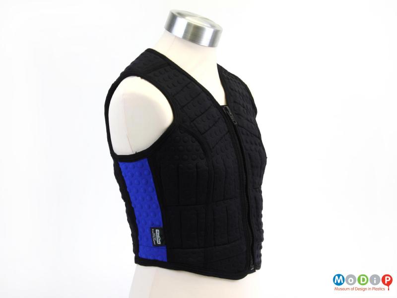 Side view of a running vest showing the blue side panel.