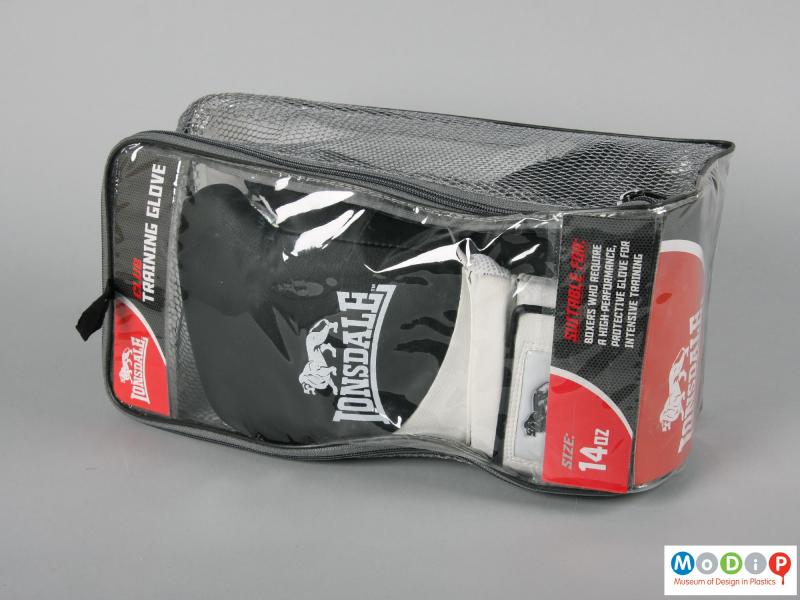 Side view of a pair of boxing gloves showing the packaging.