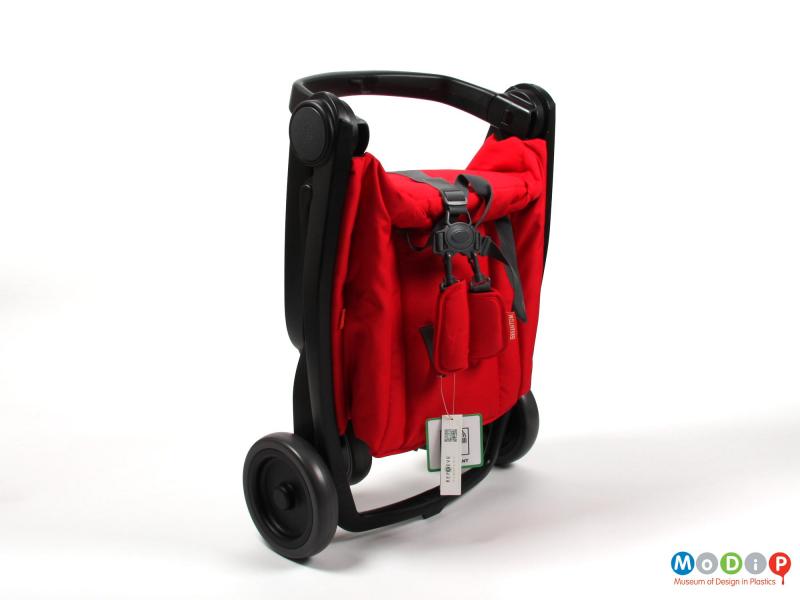Side view of a stroller showing it folded up.