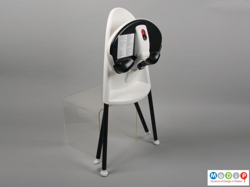 Side view of a highchair showing the chair folded.