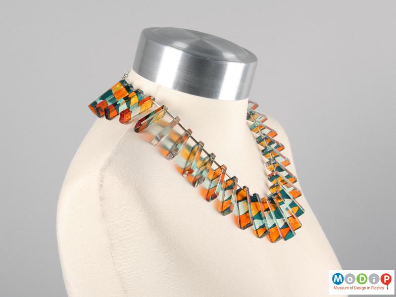 Side view of a necklace showing the rectangular sections.