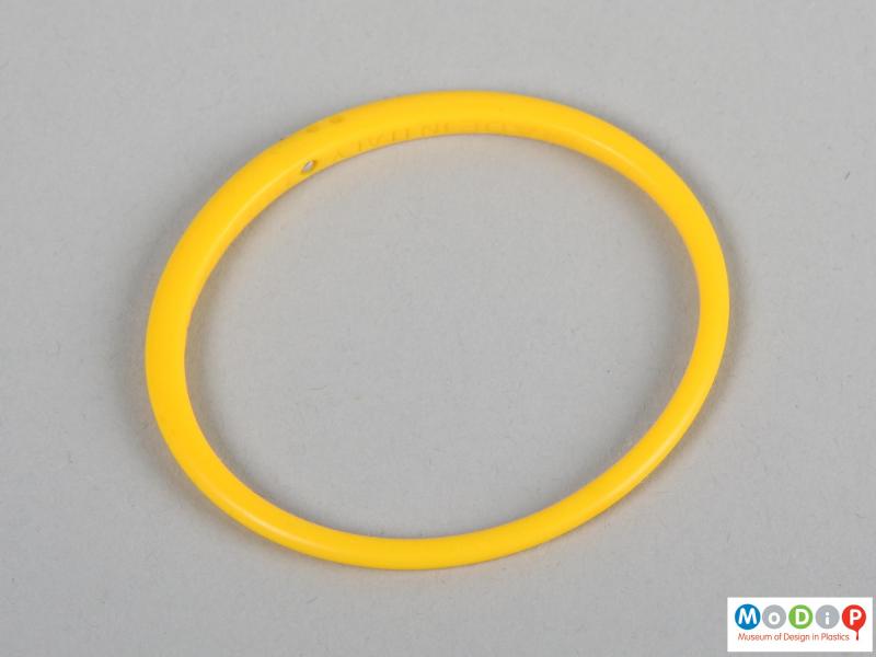 Top view of a bangle showing the differing thickness of the material.