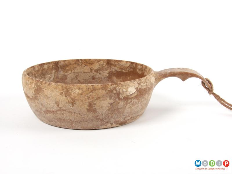 Side view of a bowl showing the curved handle.