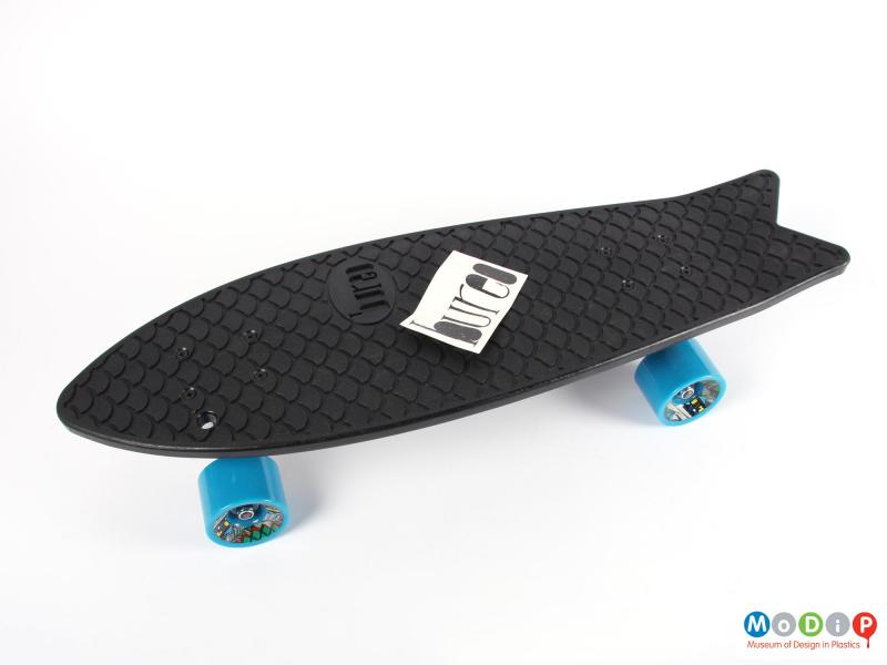 Side view of a skateboard showing the Bureo sticker.