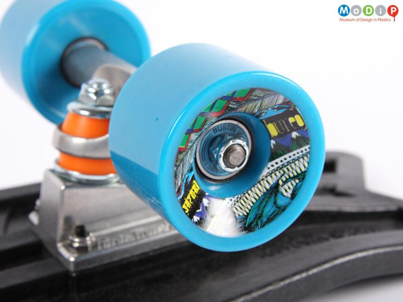 Close view of a skateboard showing the wheel.