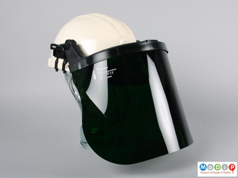 Side view of a safety hat showing the heat shield.