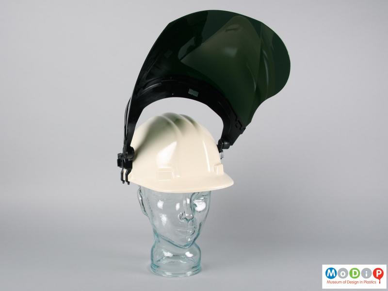 Front view of a safety hat showing the heat shield lifted.