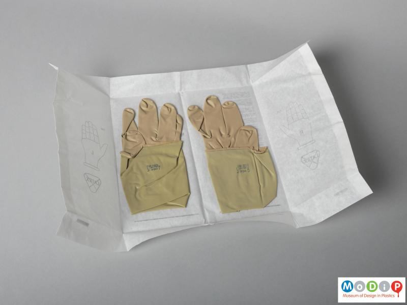 Front view of a pair of gloves showing the gloves in their inner pakaging.