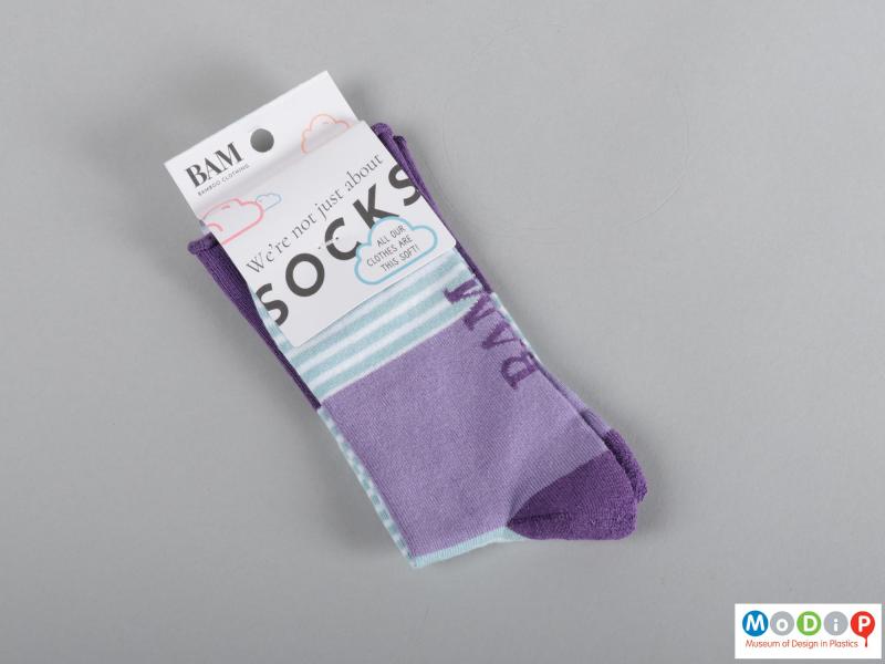Front view of a pair of socks showing the packaging.