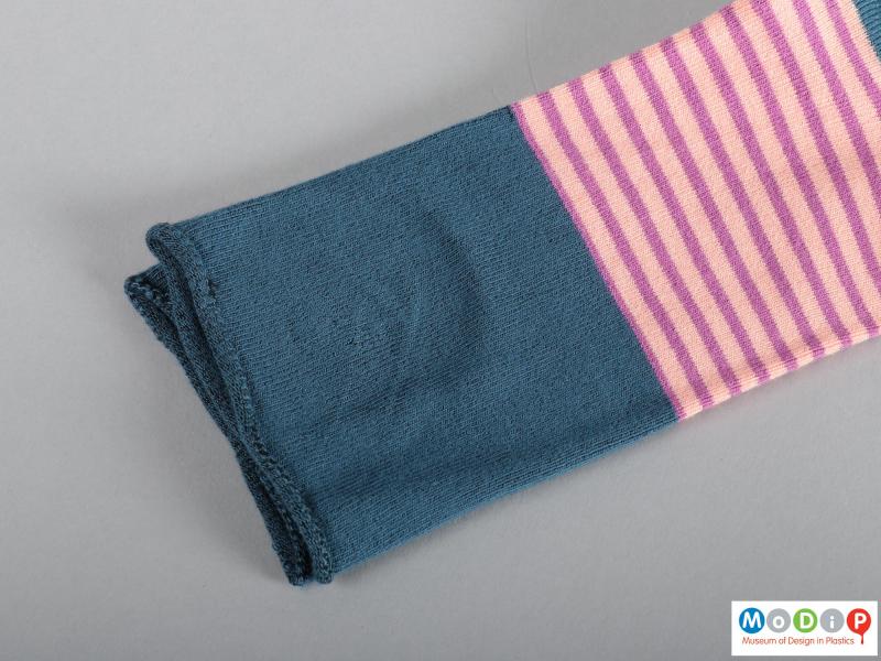 Close view of a pair of socks showing the roll cuff.
