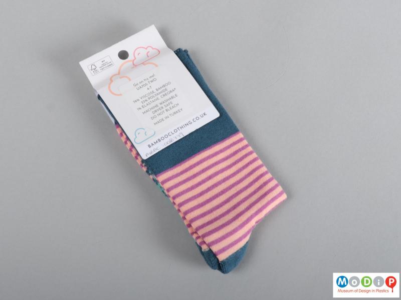 Rear view of a pair of socks showing the packaging.
