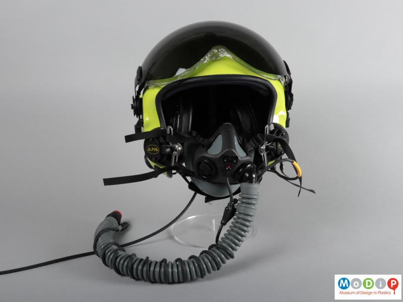 Front view of a helmet showing the visors in the up position and the oxygen mask.