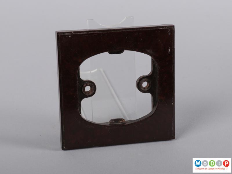 Front view of a light switch showing the surround.