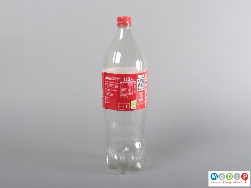Side view of a bottle showing the classic waisted shape.