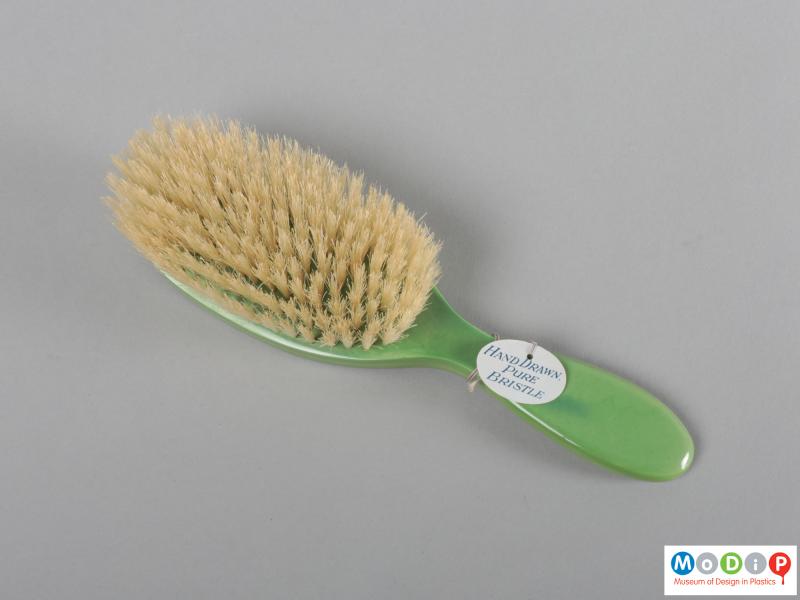 Underside view of a grooming set showing the hairbrush.