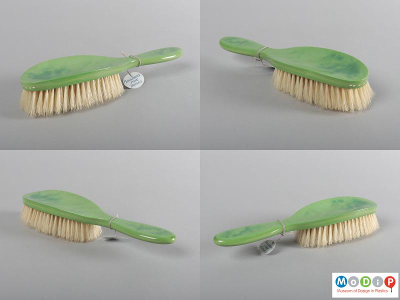 Side view of a grooming set showing four different views of the hairbrush.