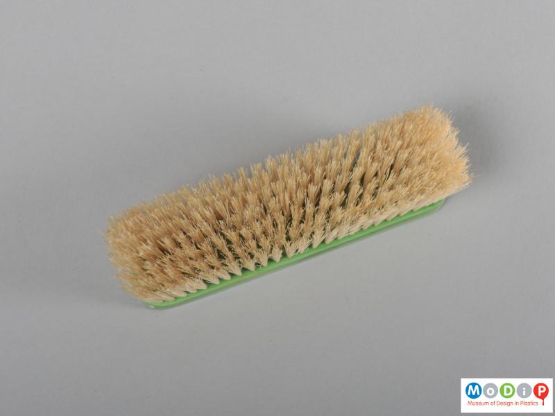Underside view of a grooming set showing the clothes brush.