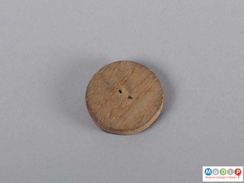 Underside view of a button showing the two holes.