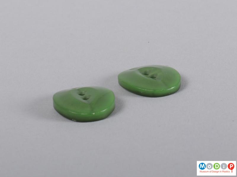 Side view of a group of buttons showing the curved sides.