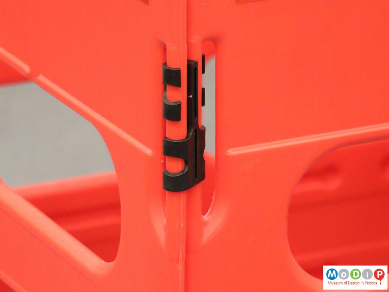 Close view of a barrier showing the connecting hinges.