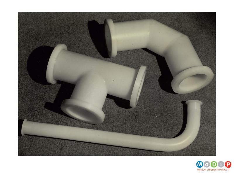 Scanned image showing three different pipe fittings.