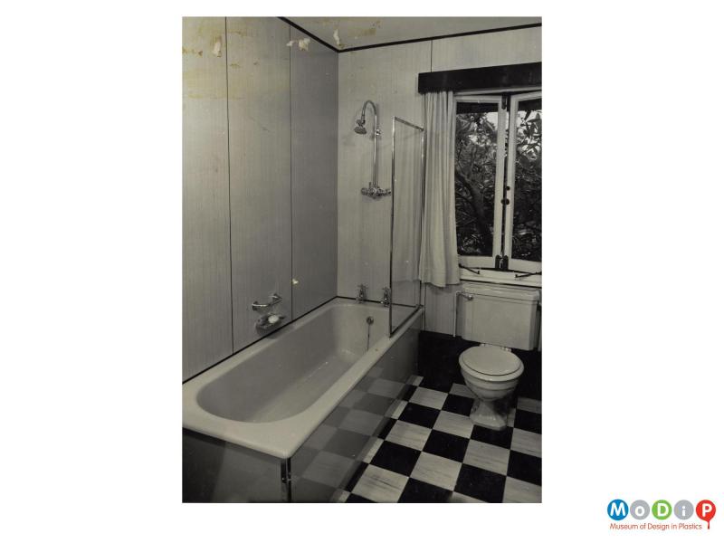Scanned image showing wall panels in a bathroom setting.