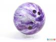 Side view of a bowling ball showing the drill finger holes.