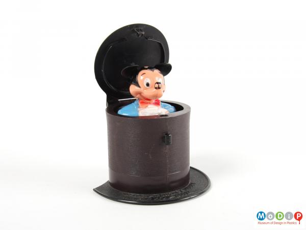 Front view of a pop up toy showing the lid open and the mouse up.