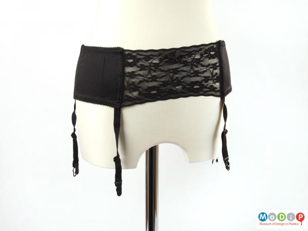 Front view of a suspender belt showing the lace panel.