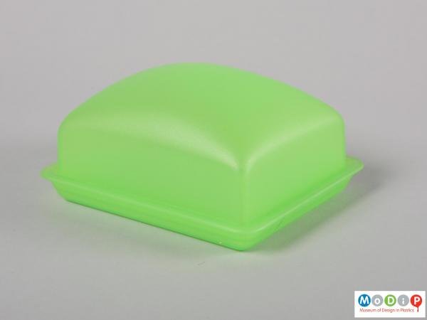 Side view of a butter dish showing the smooth shape.