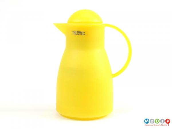Side view of a Thermos jug showing the smooth lines and dome stopper.