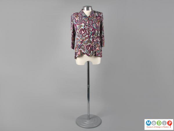 Front view of a blouse showing the colourful fabric.