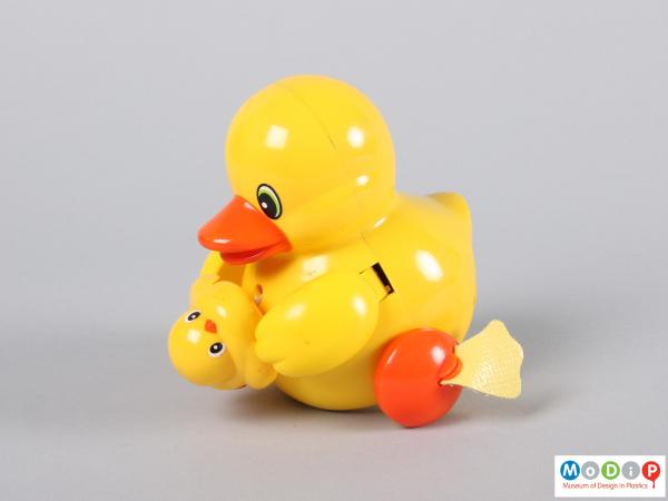 Side view of a duck toy showing the mother and duckling.