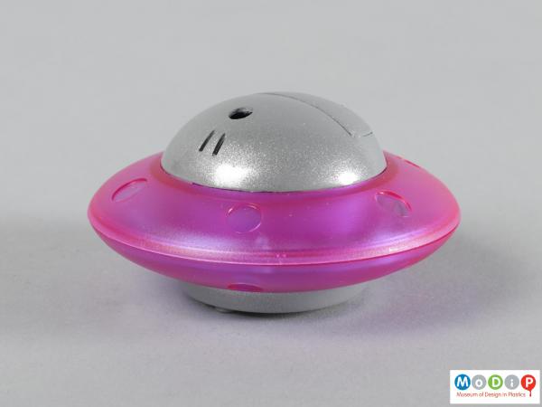 Side view of a cigarette lighter showing the flying saucer shape.