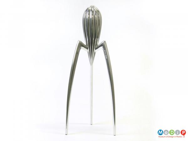 Side view of a juicer showing the long angular legs.