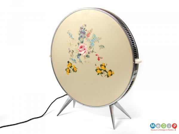 Front view of a Sofono electric heater showing the angular legs at the base and thepeeling floral transfers.