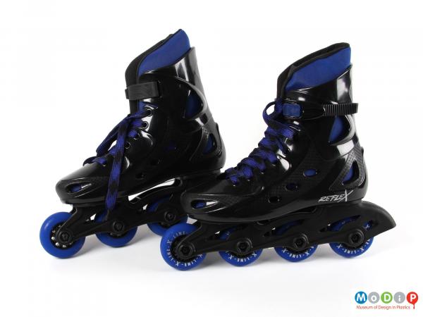Side view of a pair of inline skates showing the small wheels.