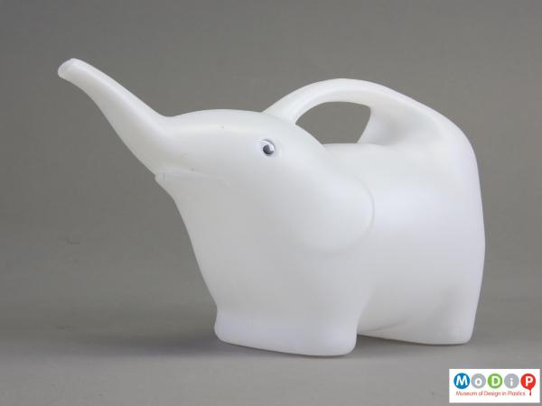 Side view of a watering can showing the elephant shape.