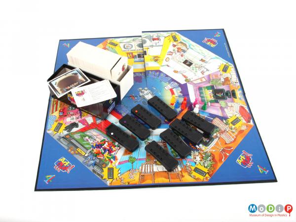 Top view of a board game showing the board and playing pieces.