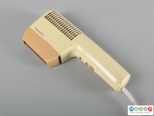 Side view of a hairdryer showing the rectangular shape and air grill.