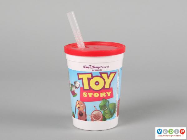 Side view of a Toy Story beaker showing the printed illustration running around the outside.