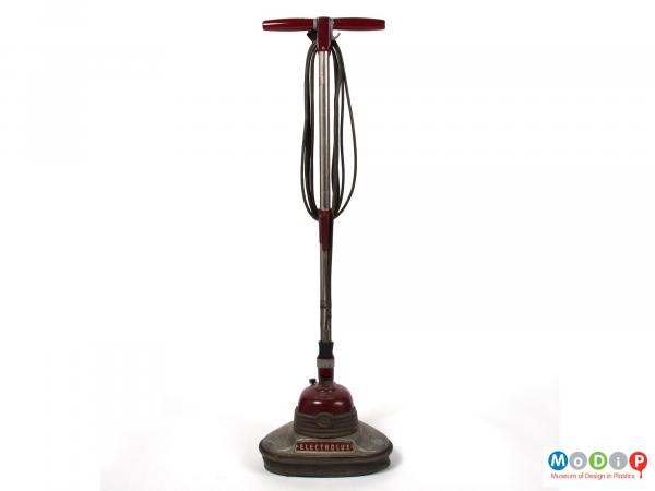 Front view of an Electrolux floor polisher showing the cable coiled and hanging on specific hooks.