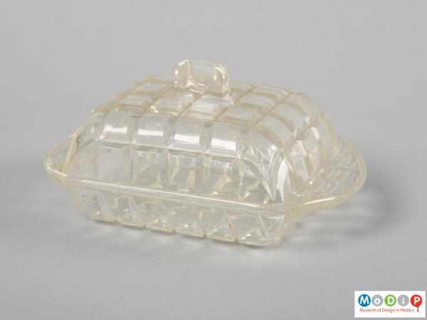 Side view of a butter dish showing the curved shape.