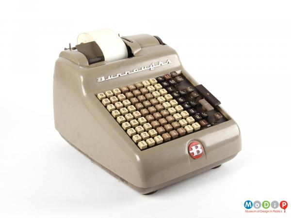 Side view of a Burroughs Adding Machine showing the metal body and plastic keys.