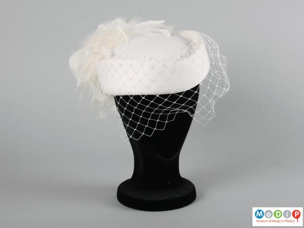 Front view of a hat showing the net veil.