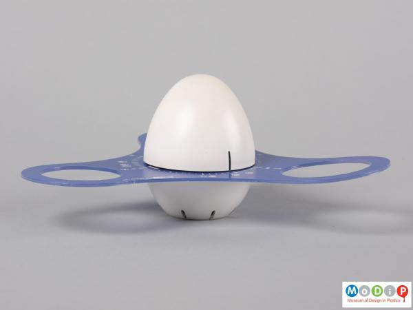 Side view of an Ad Hoc egg timer showing the central egg shaped mechanism and the blue surround.