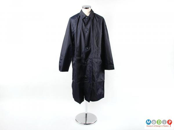 Front view of a rain coat showing the button fastening.