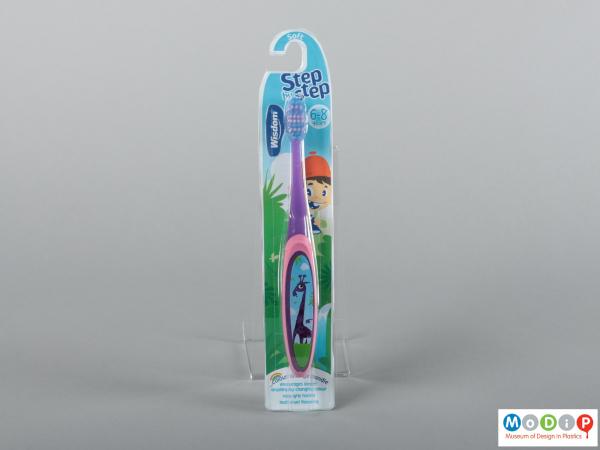 Front view of a pair of packaged toothbrushes showing the handles and bristles.